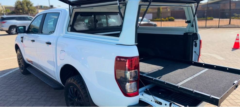 Rear of the Ford Ranger FX4 with the tailgate down and the lined slide-out load tray extended